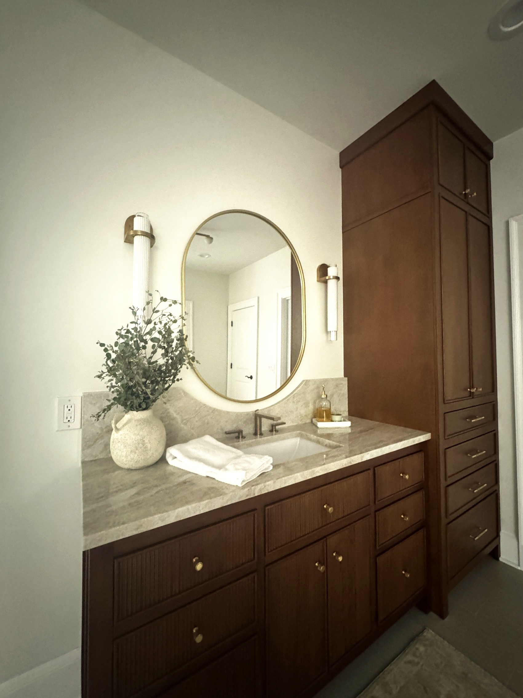 Walnut vanity, full view, with tall linen cabinet.
