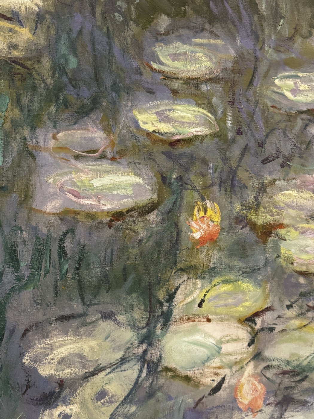 An impressionist water lily painting in soft greens, lavenders, and gold.